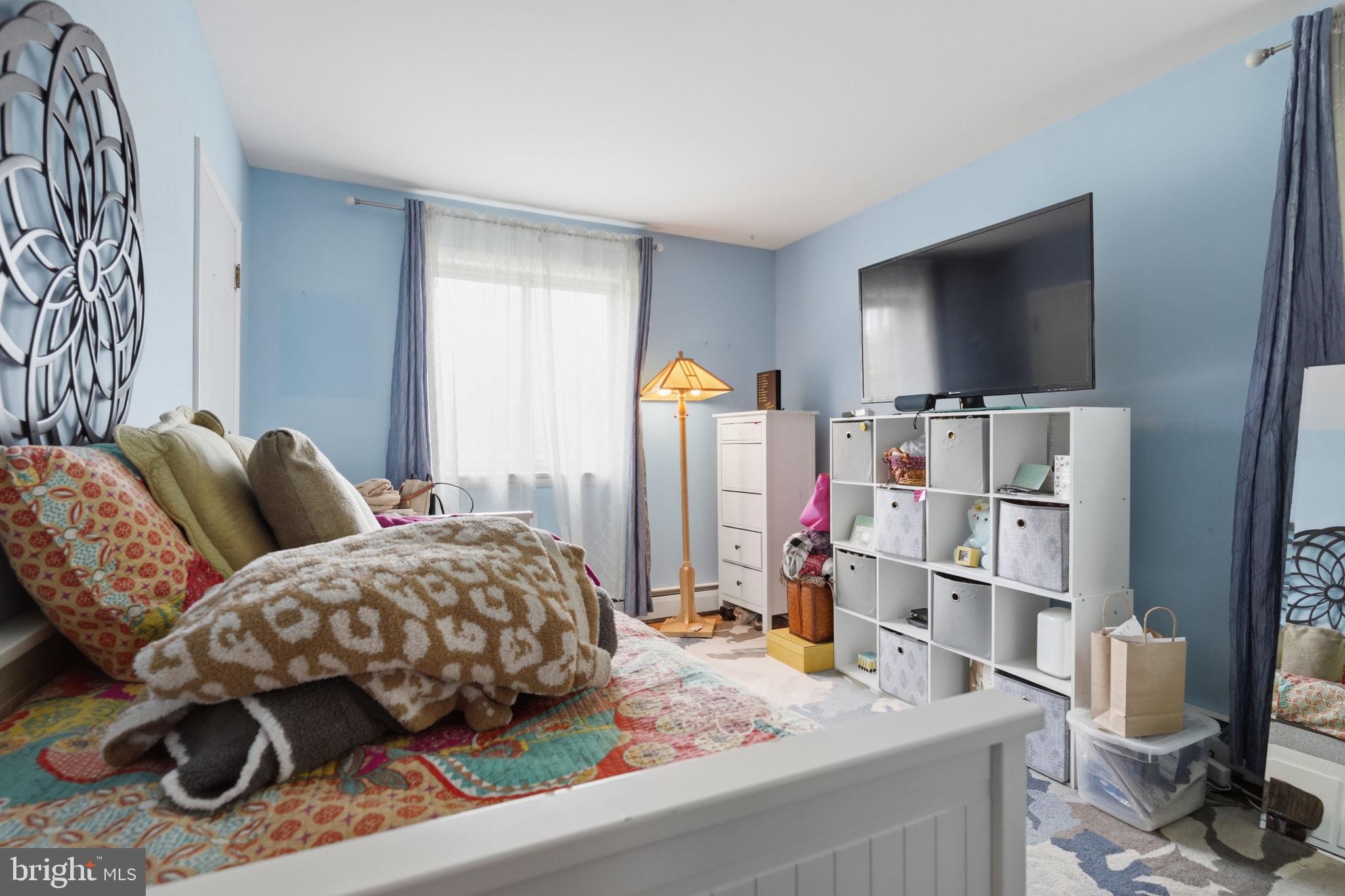 318 Warwick Road Lawnside, NJ 08045 - Photo 17 of 25 Cozy retreat with serene blue hues.