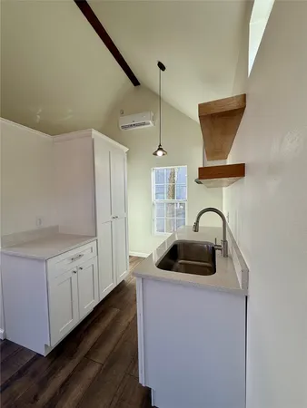 a kitchen with a sink and a stove