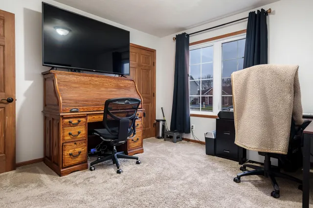 a bed room with a bed and a mirror