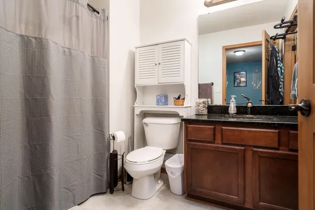 a front view of house with yard and trees