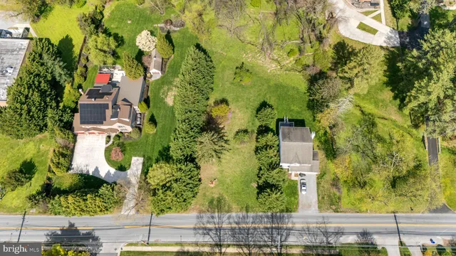 an aerial view of residential house with an outdoor space