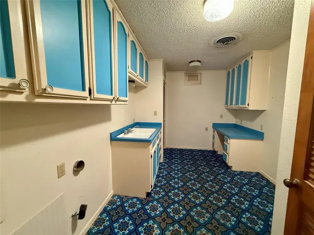 a large body of water with a tree in the background