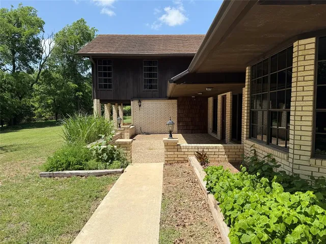a view of a house with a big yard