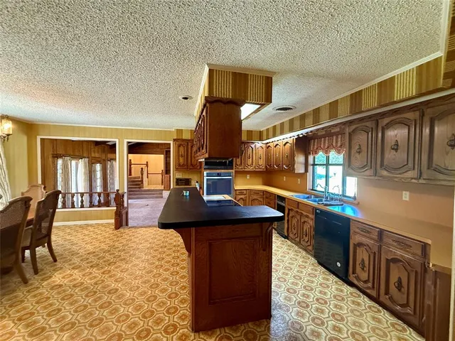 a living room with furniture a dining table and chairs