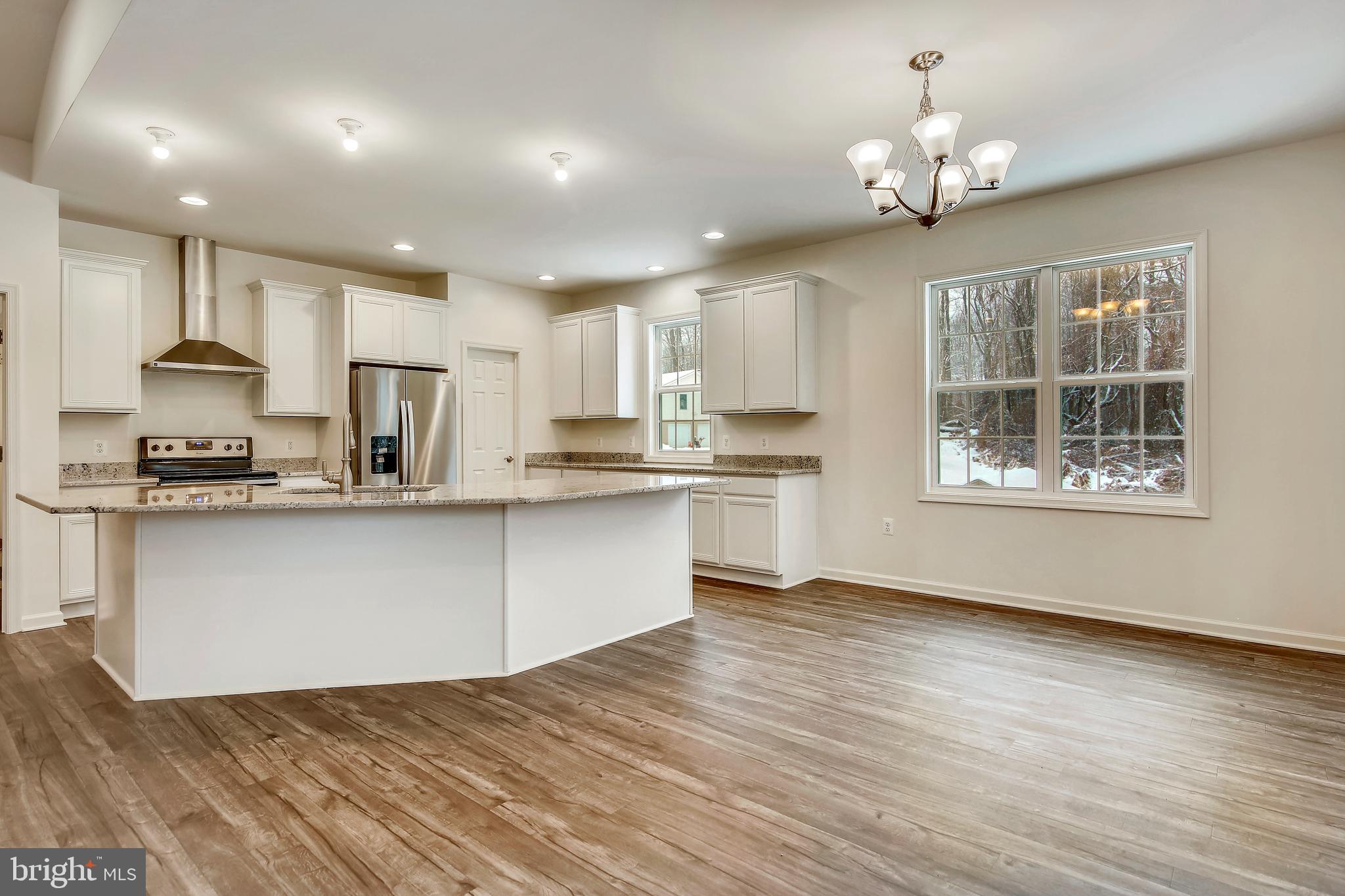 1 Cedar Ridge Road Rapidan, VA 22733 - Photo 13 of 13 a open kitchen with kitchen island white cabinets and refrigerator