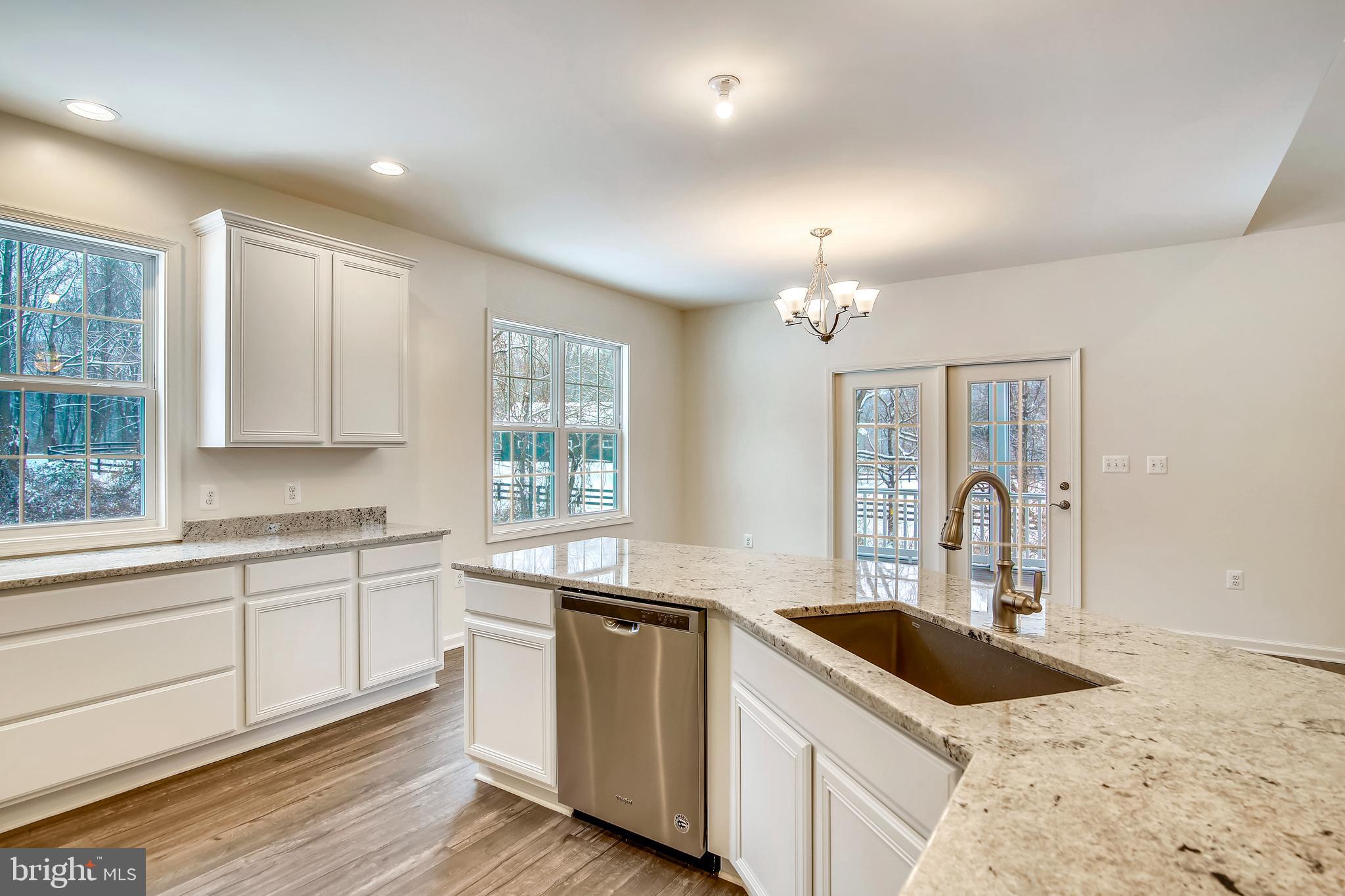 1 Cedar Ridge Road Rapidan, VA 22733 - Photo 4 of 13 a kitchen with granite countertop a sink stove and cabinets