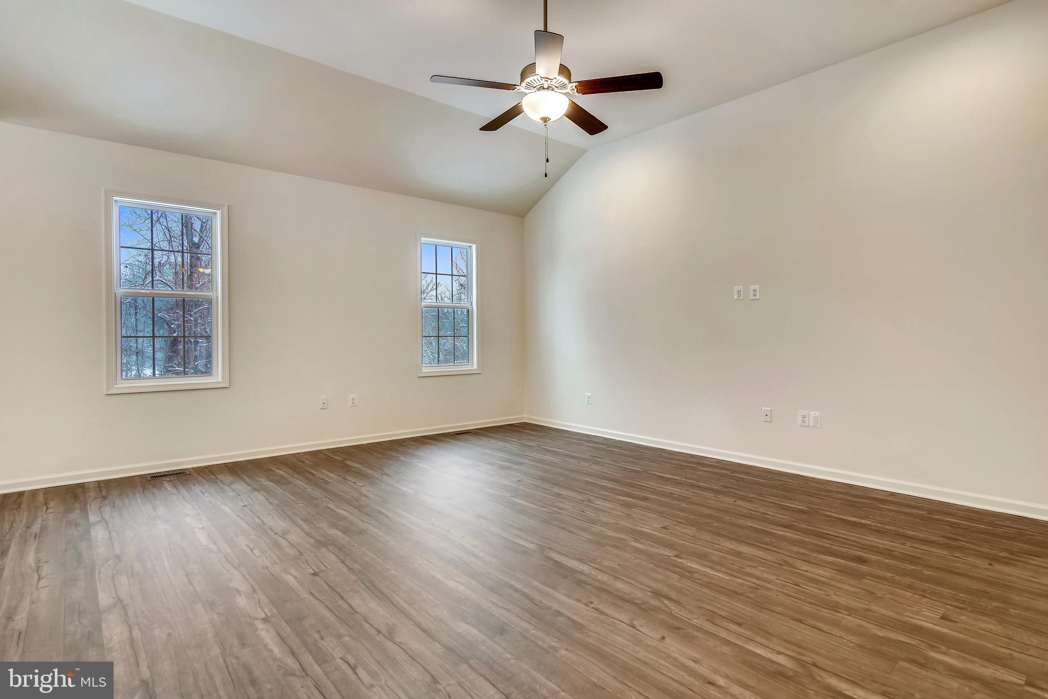 1 Cedar Ridge Road Rapidan, VA 22733 - Photo 6 of 13 a view of an empty room with wooden floor and a window