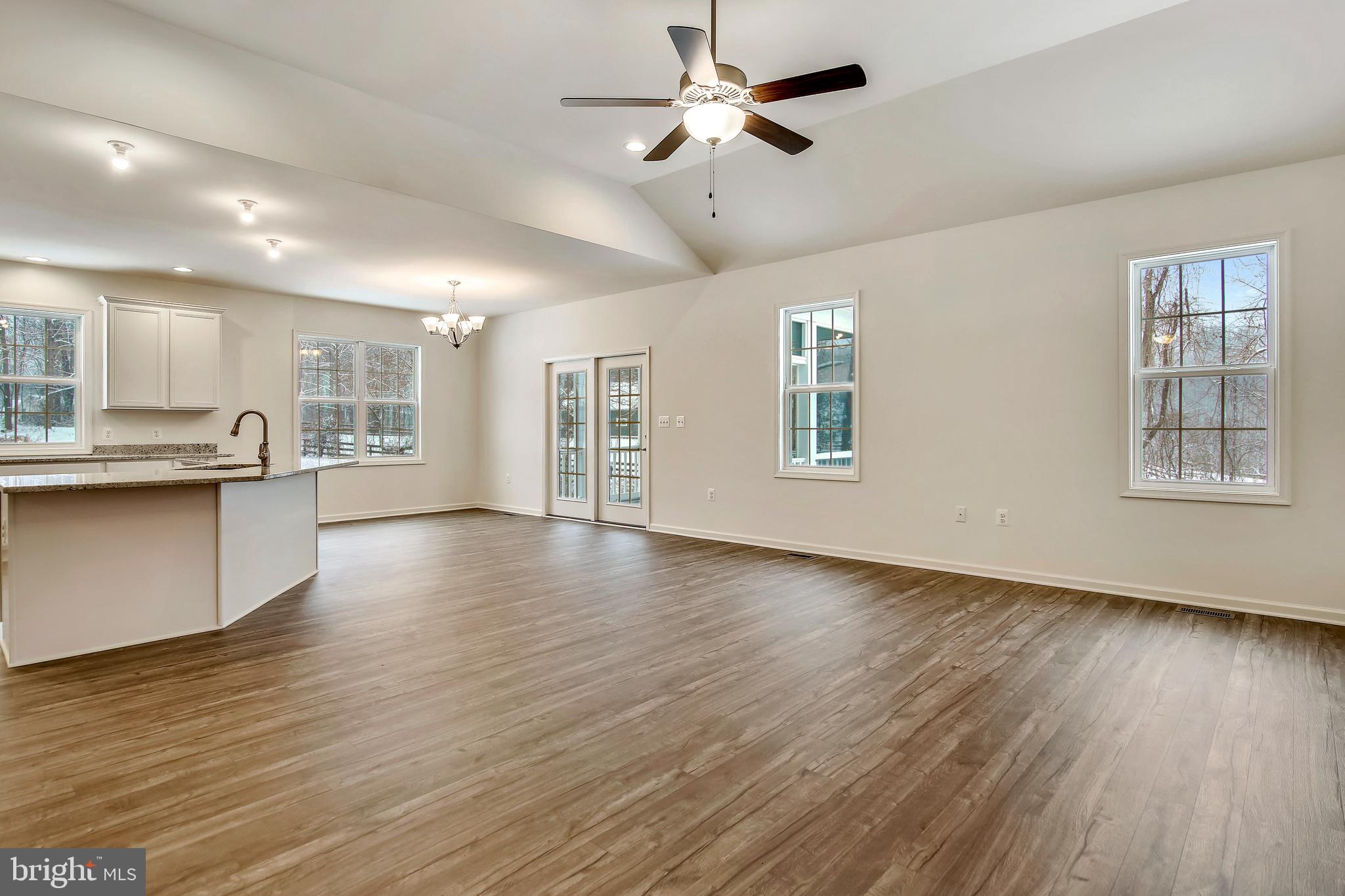 1 Cedar Ridge Road Rapidan, VA 22733 - Photo 7 of 13 a view of an empty room with window and wooden floor