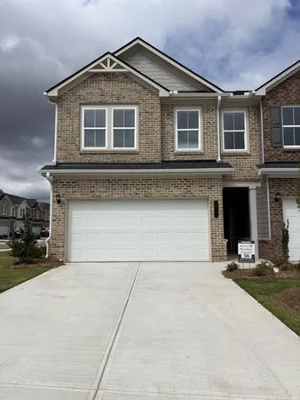 a front view of a house with yard