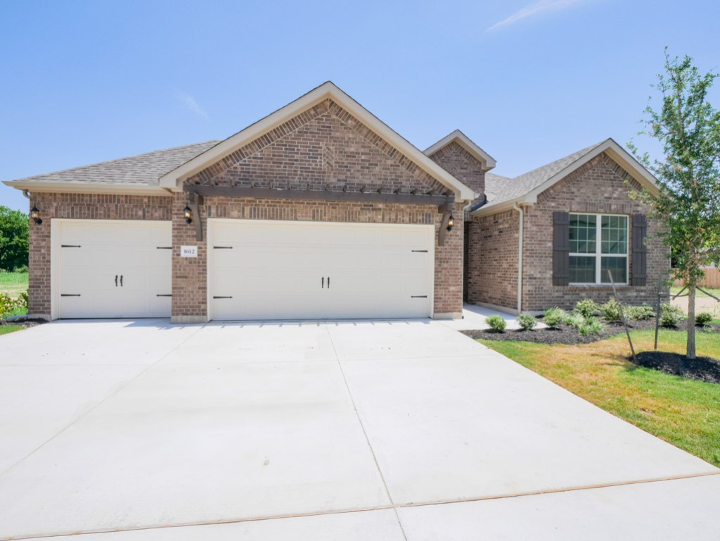 a view of garage yard and tree