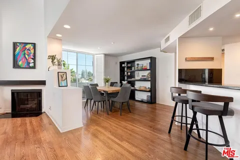 a view of a livingroom with furniture and a flat screen tv