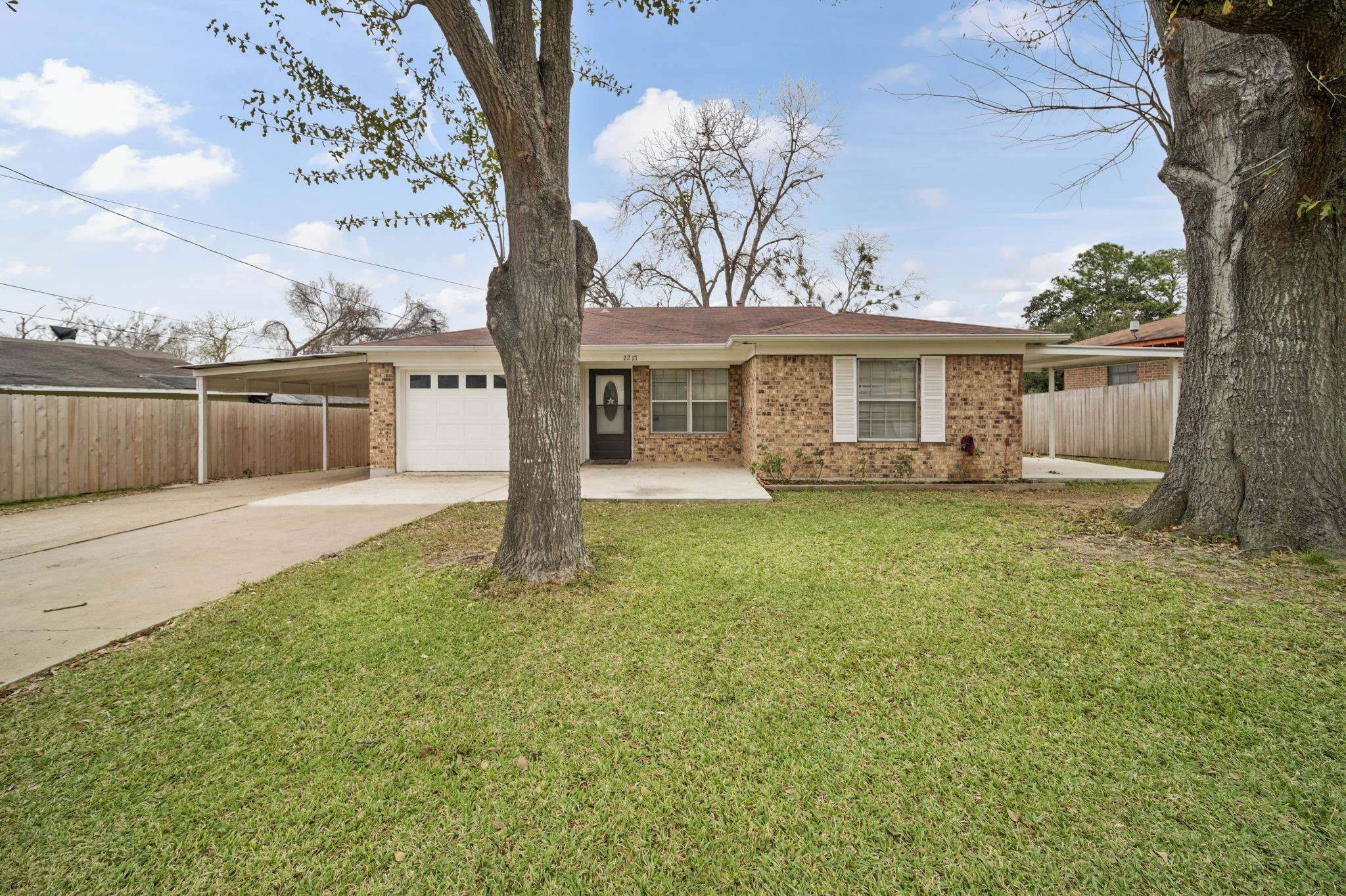 2217 Old Chappell Hill Road Brenham, TX 77833 - Photo 1 of 28 a view of a house with backyard sitting area and garden