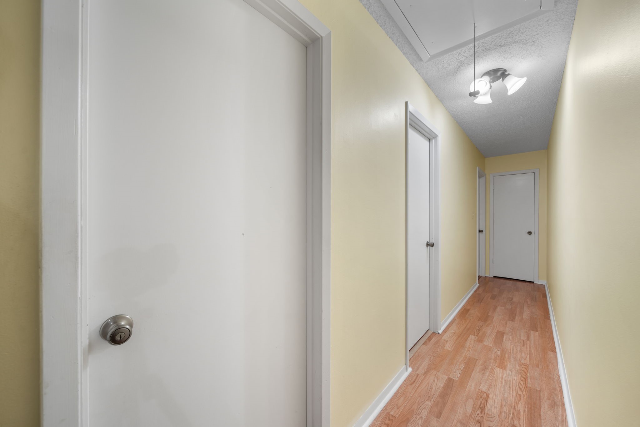 2217 Old Chappell Hill Road Brenham, TX 77833 - Photo 11 of 28 a view of a hallway with wooden floor