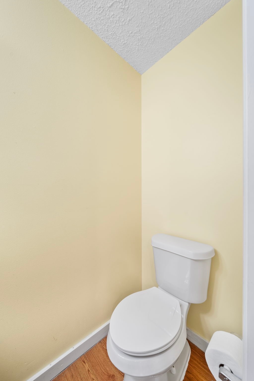 2217 Old Chappell Hill Road Brenham, TX 77833 - Photo 15 of 28 a white toilet sitting next to a white wall