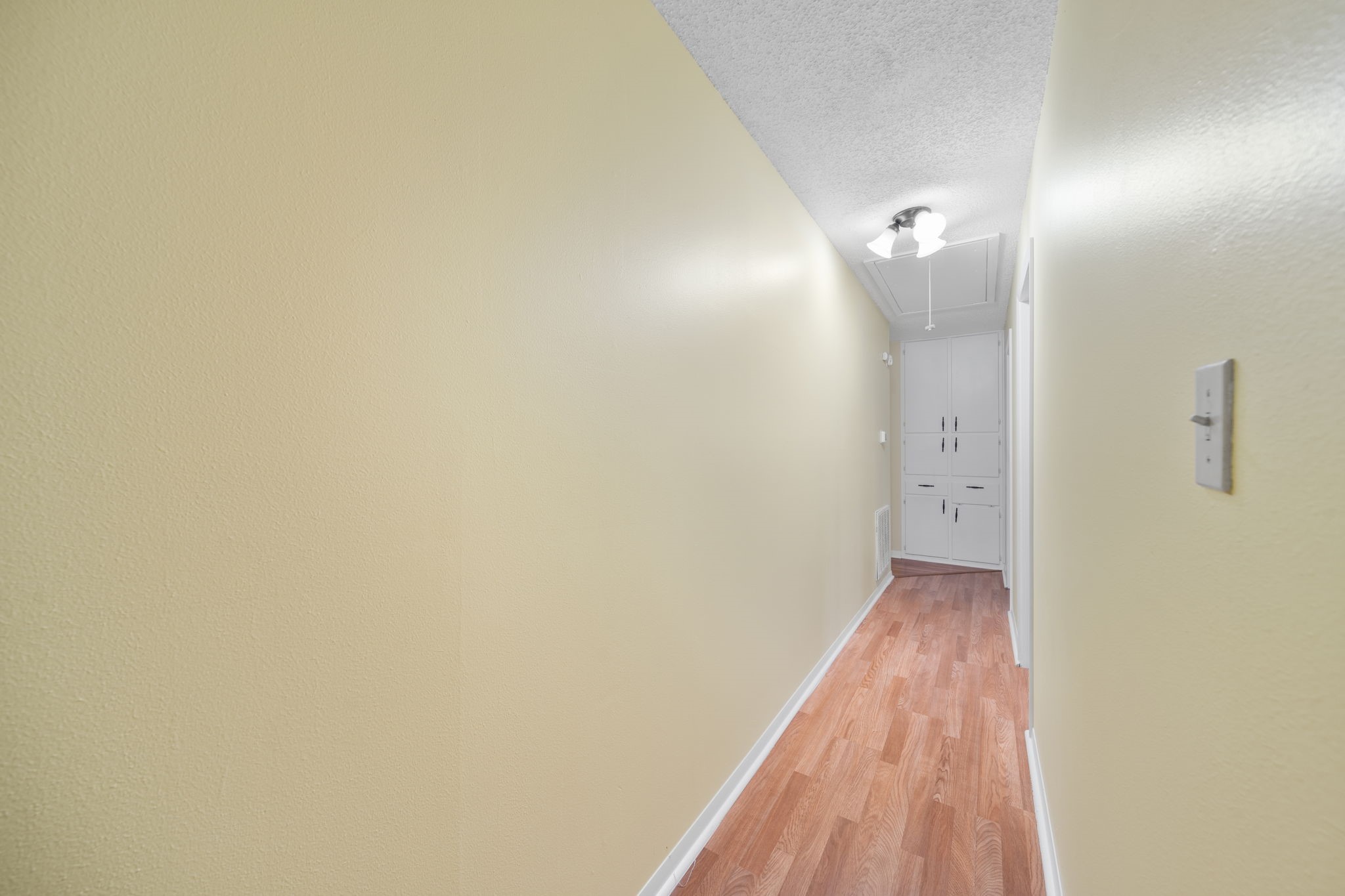 2217 Old Chappell Hill Road Brenham, TX 77833 - Photo 19 of 28 a view of a hallway with wooden floor