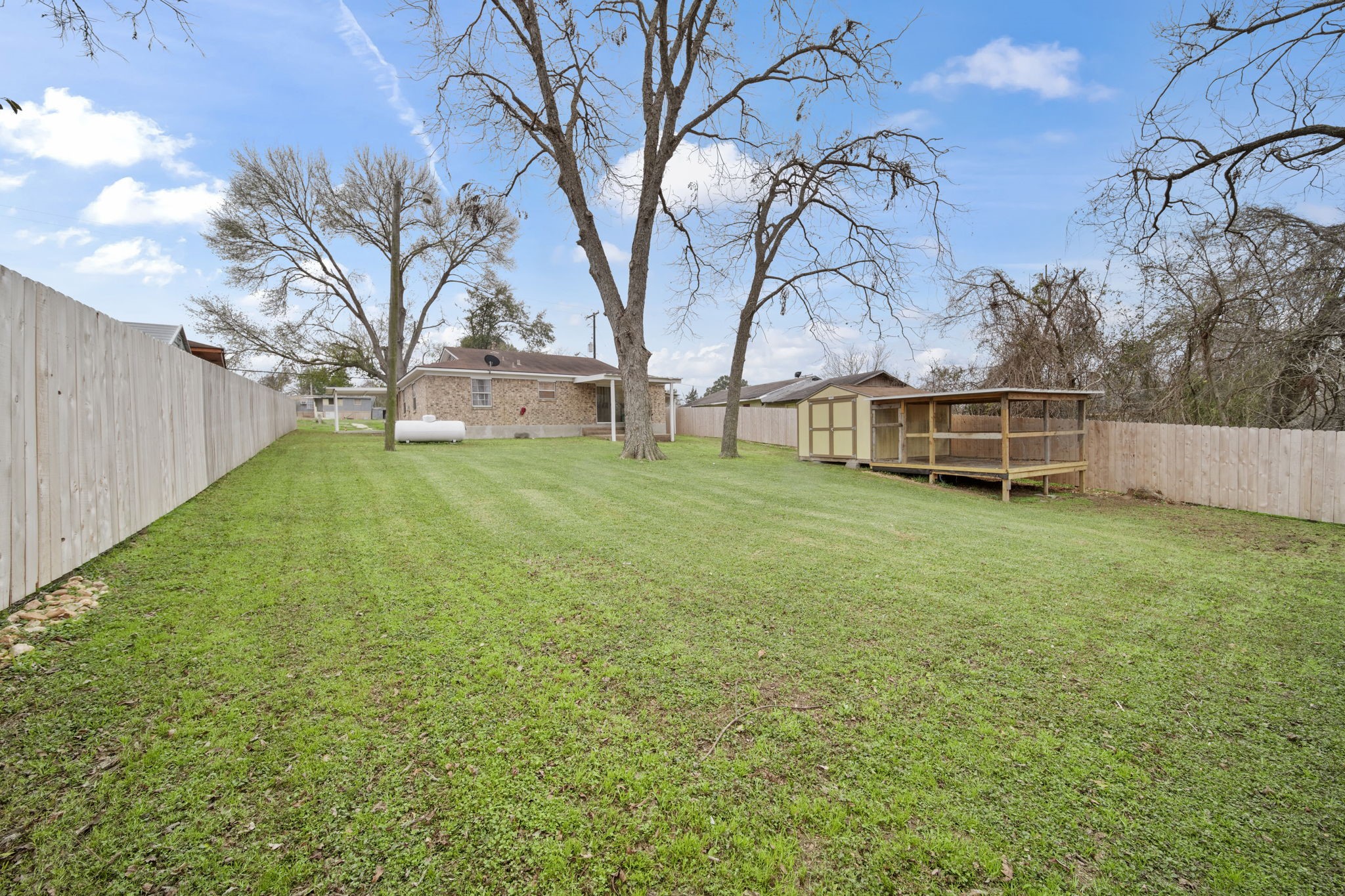 2217 Old Chappell Hill Road Brenham, TX 77833 - Photo 21 of 28 a view of a backyard with a garden