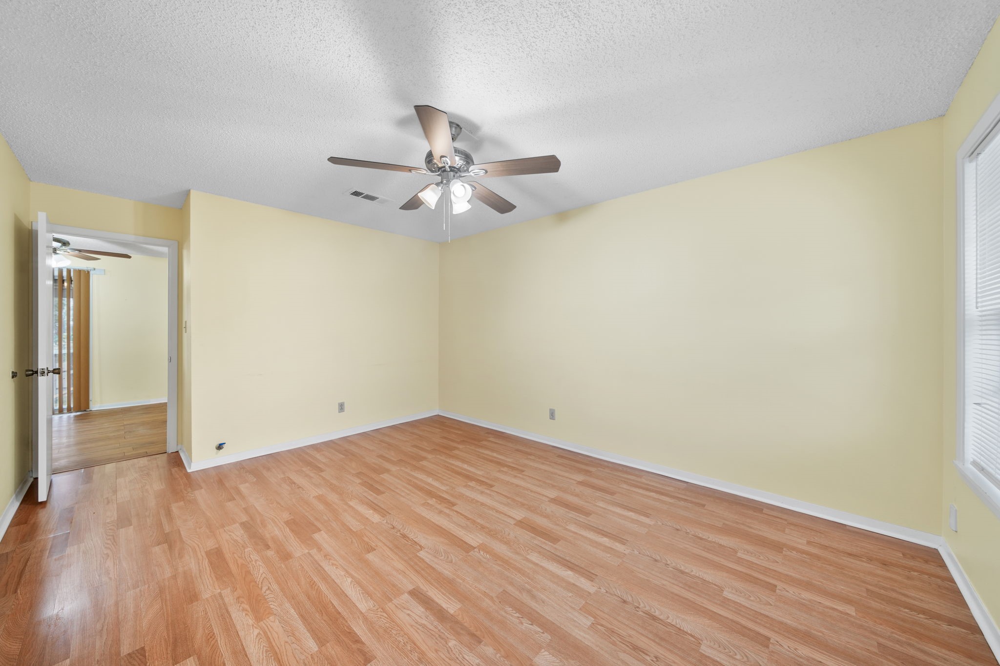 2217 Old Chappell Hill Road Brenham, TX 77833 - Photo 4 of 28 a view of an empty room with wooden floor
