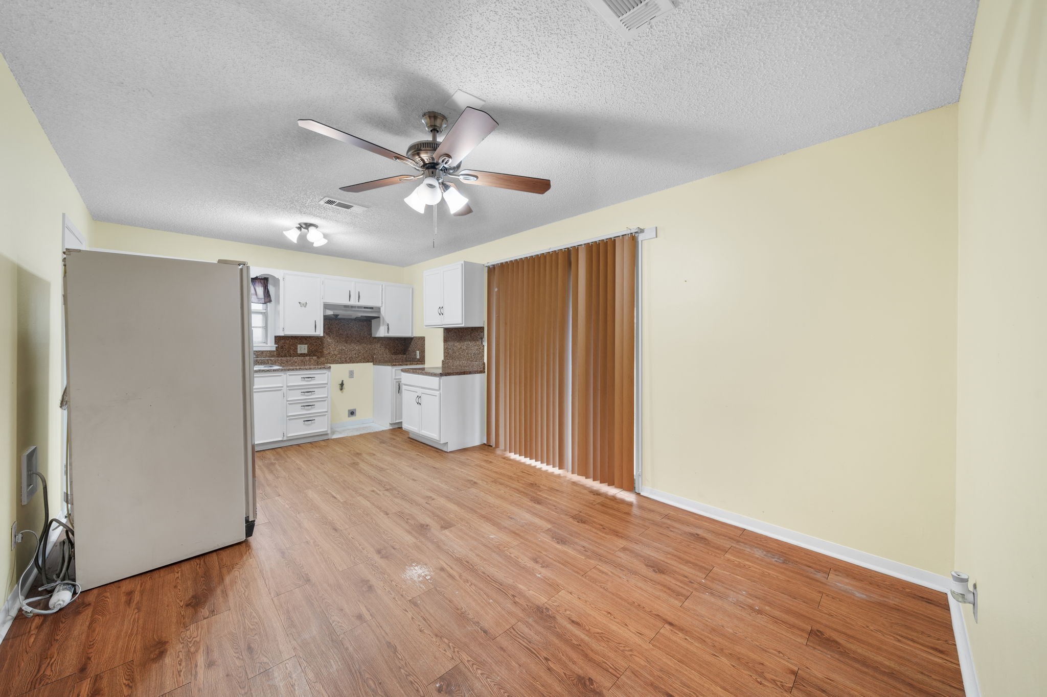 2217 Old Chappell Hill Road Brenham, TX 77833 - Photo 6 of 28 a view of a kitchen with a sink and a refrigerator