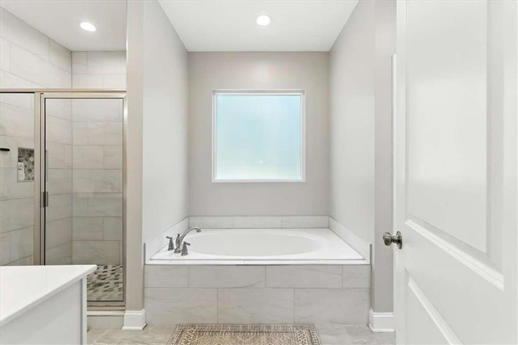 62 Joe Rowell Road Buchanan, GA 30113 - Photo 30 of 63 a bathroom with a bathtub and shower