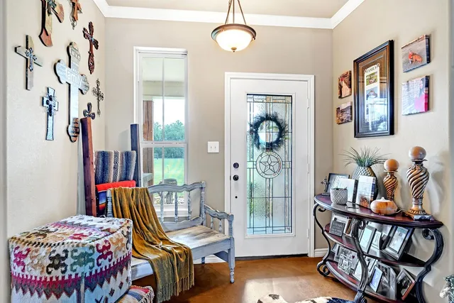 a bedroom with furniture and a window