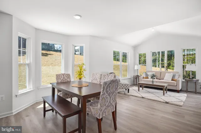 a view of a livingroom with furniture and wooden floor