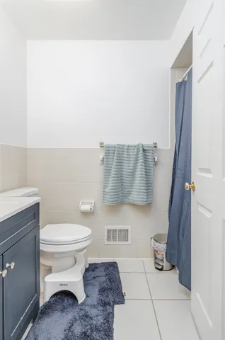 a bathroom with a toilet and a sink