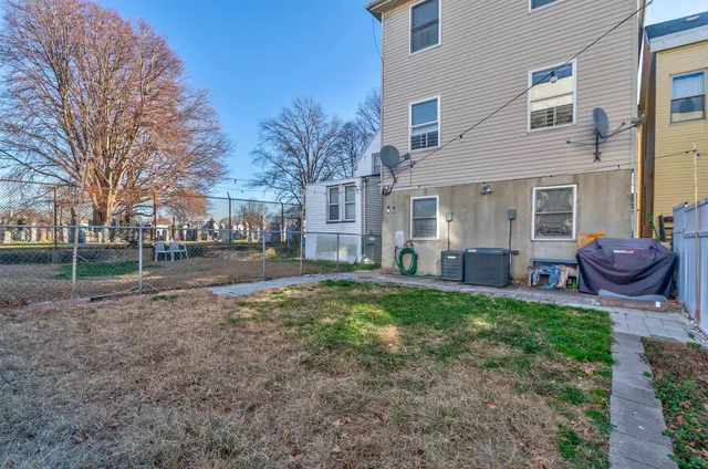 a view of a backyard of the house