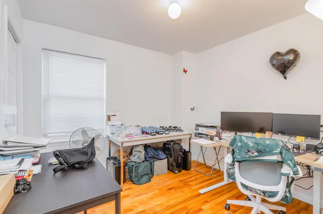 a workspace with furniture and a wooden floor