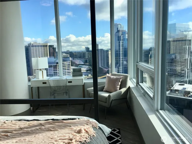 a room with furniture and a large window