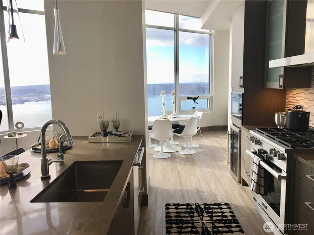 a kitchen with a stove and a sink