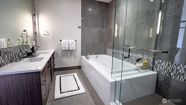 a bathroom with a bathtub and a sink