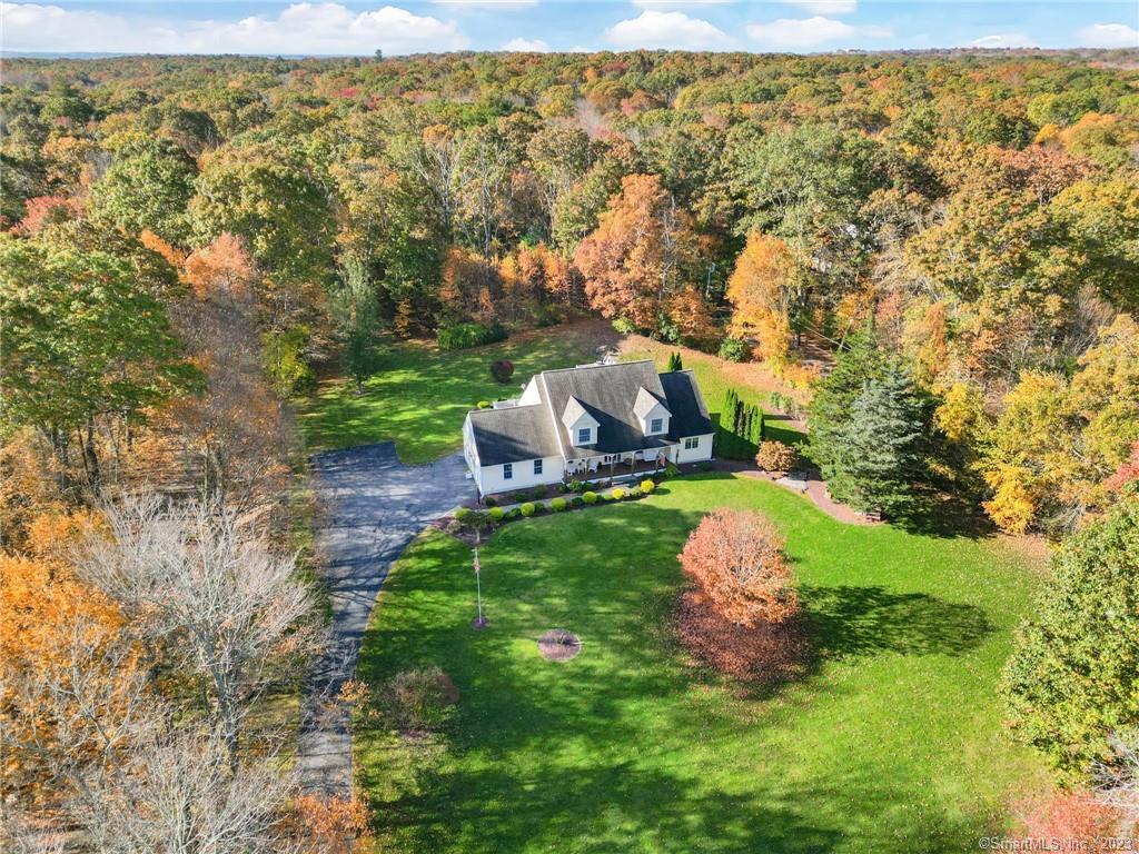 a view of a yard with table and chairs