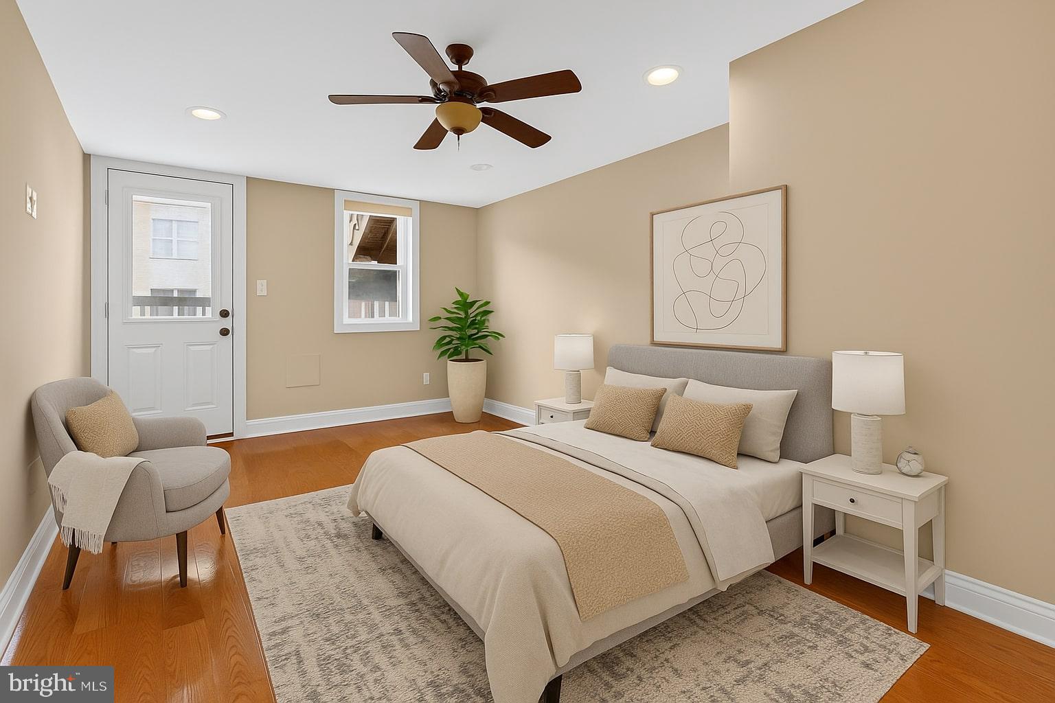 1473 Reynolds Street Baltimore, MD 21230 - Photo 19 of 43 a spacious bedroom with a bed and furniture