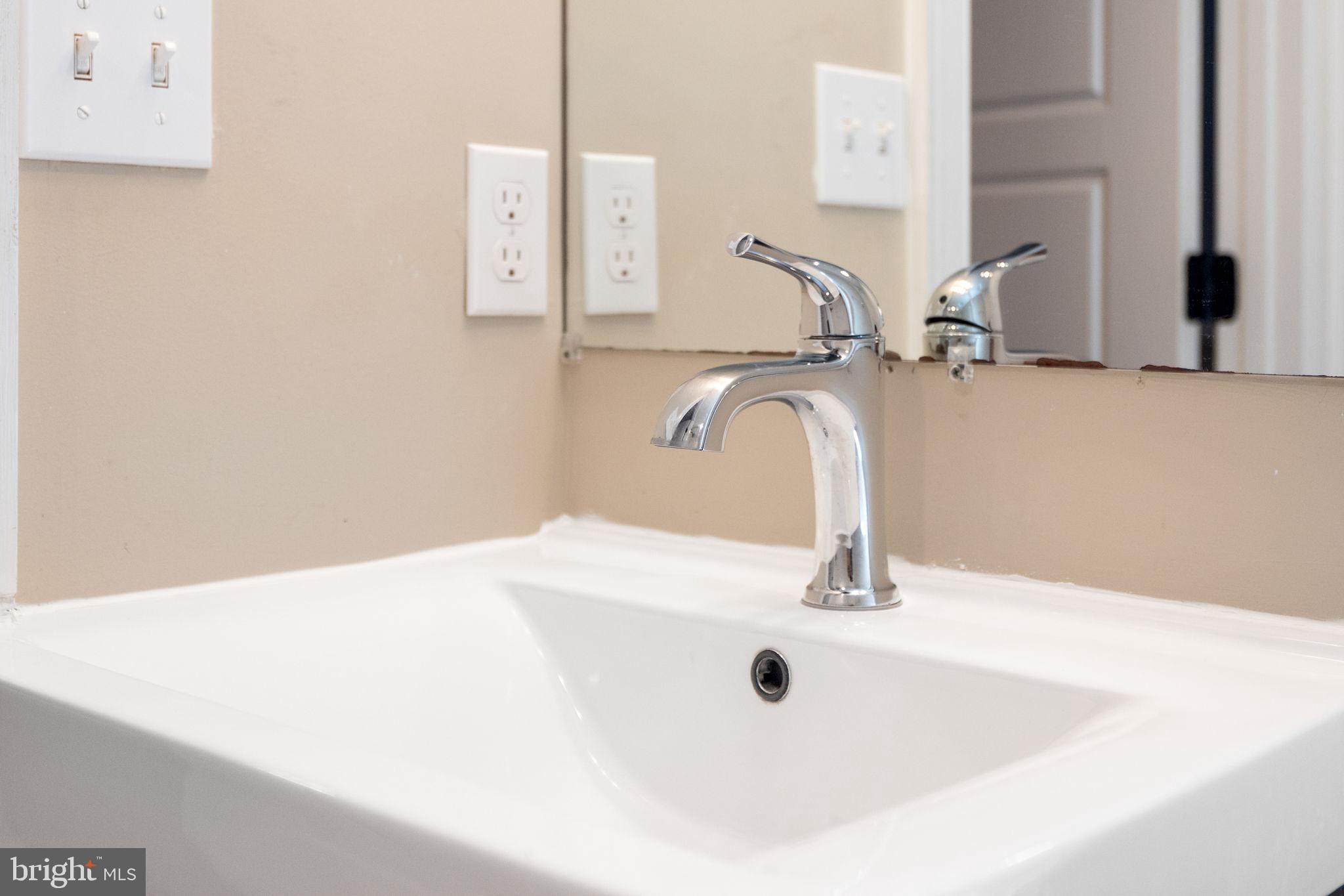 1473 Reynolds Street Baltimore, MD 21230 - Photo 31 of 43 a bathroom with a sink