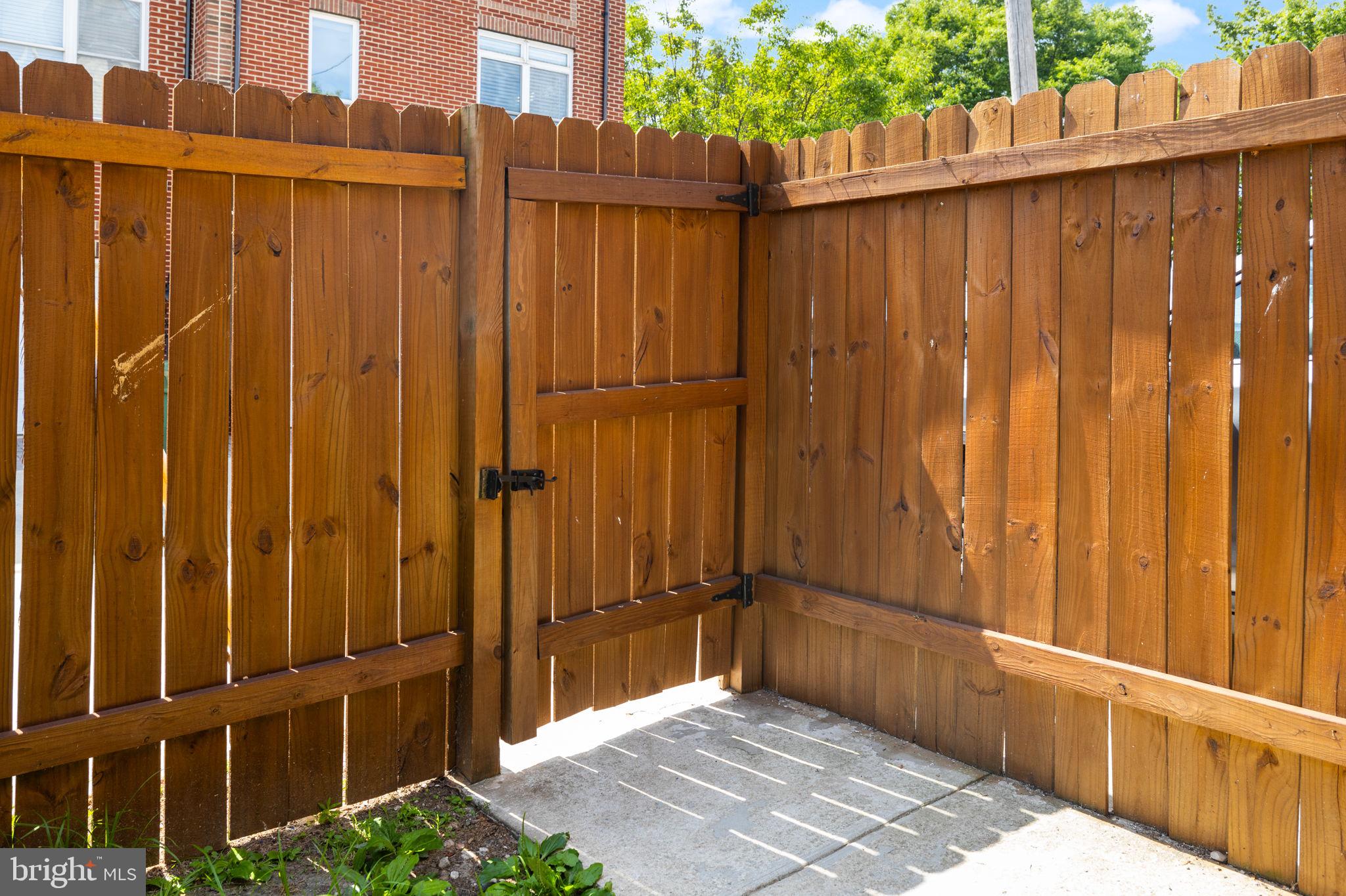 1473 Reynolds Street Baltimore, MD 21230 - Photo 42 of 43 a view of a house with a wooden fence