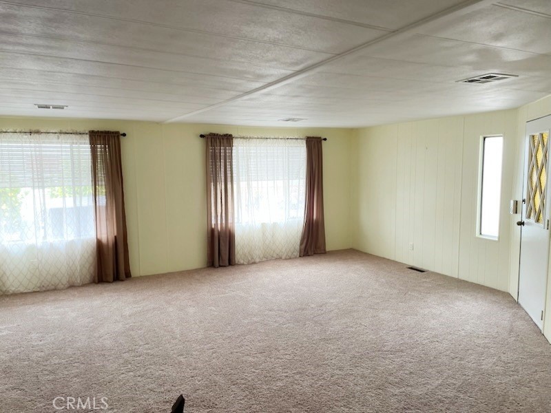 14851 Jeffrey Road, Unit 326 Irvine, CA 92618 - Photo 9 of 13 an empty room with windows