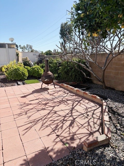 14851 Jeffrey Road, Unit 326 Irvine, CA 92618 - Photo 10 of 13 a bench sitting in the middle of a yard