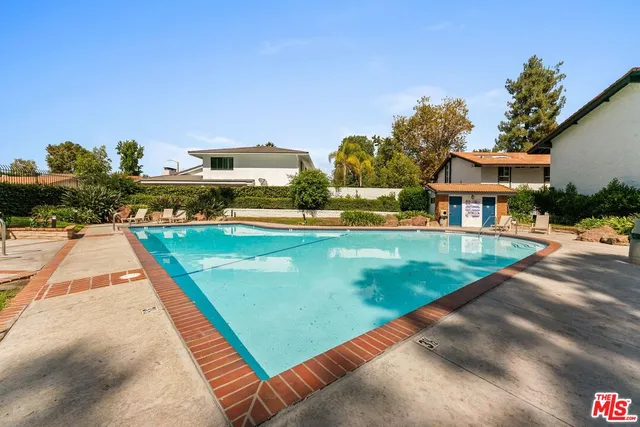 a view of a house with swimming pool
