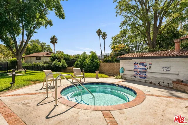 a view of a swimming pool with a patio