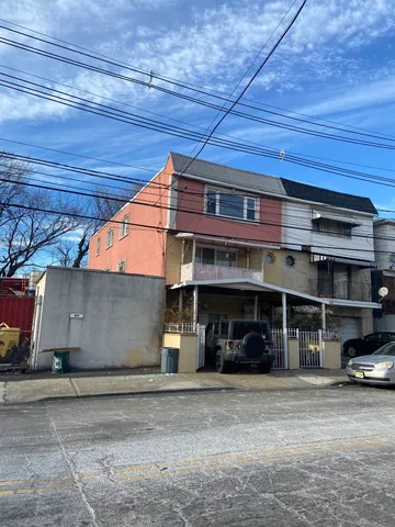 a view of a car park in front of house