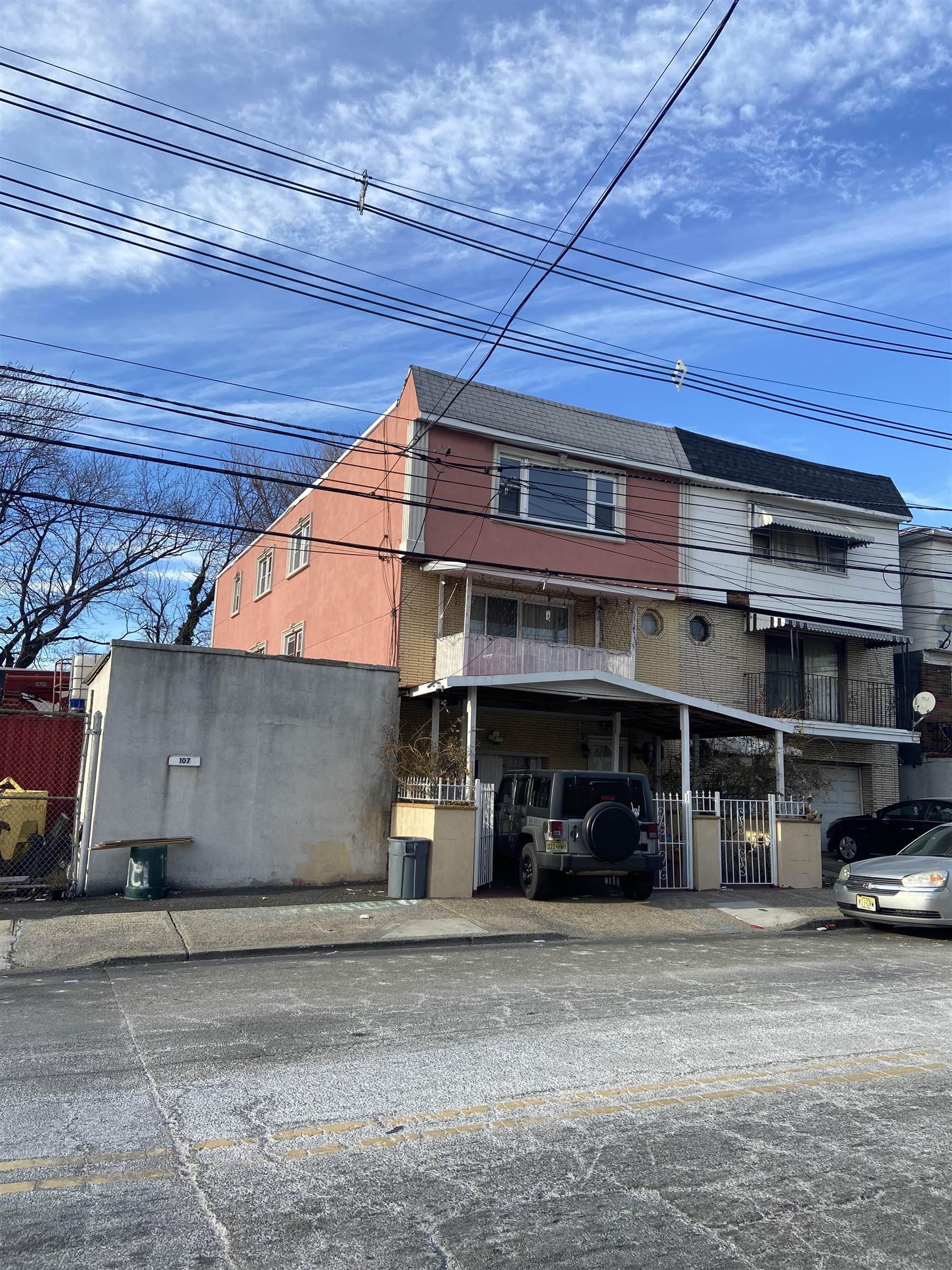 a view of a car park in front of house