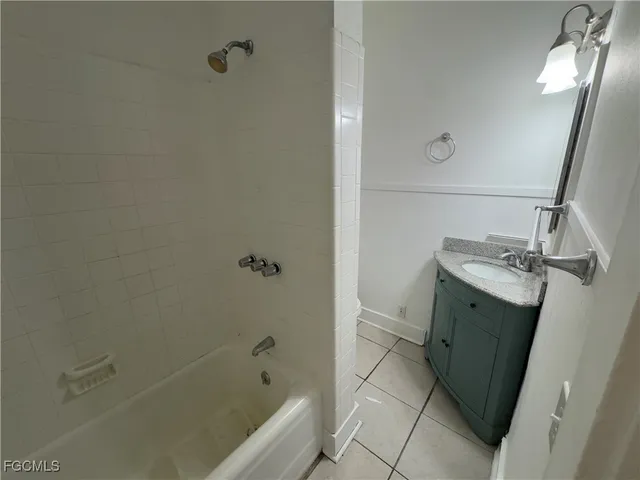 a bathroom with a sink and mirror