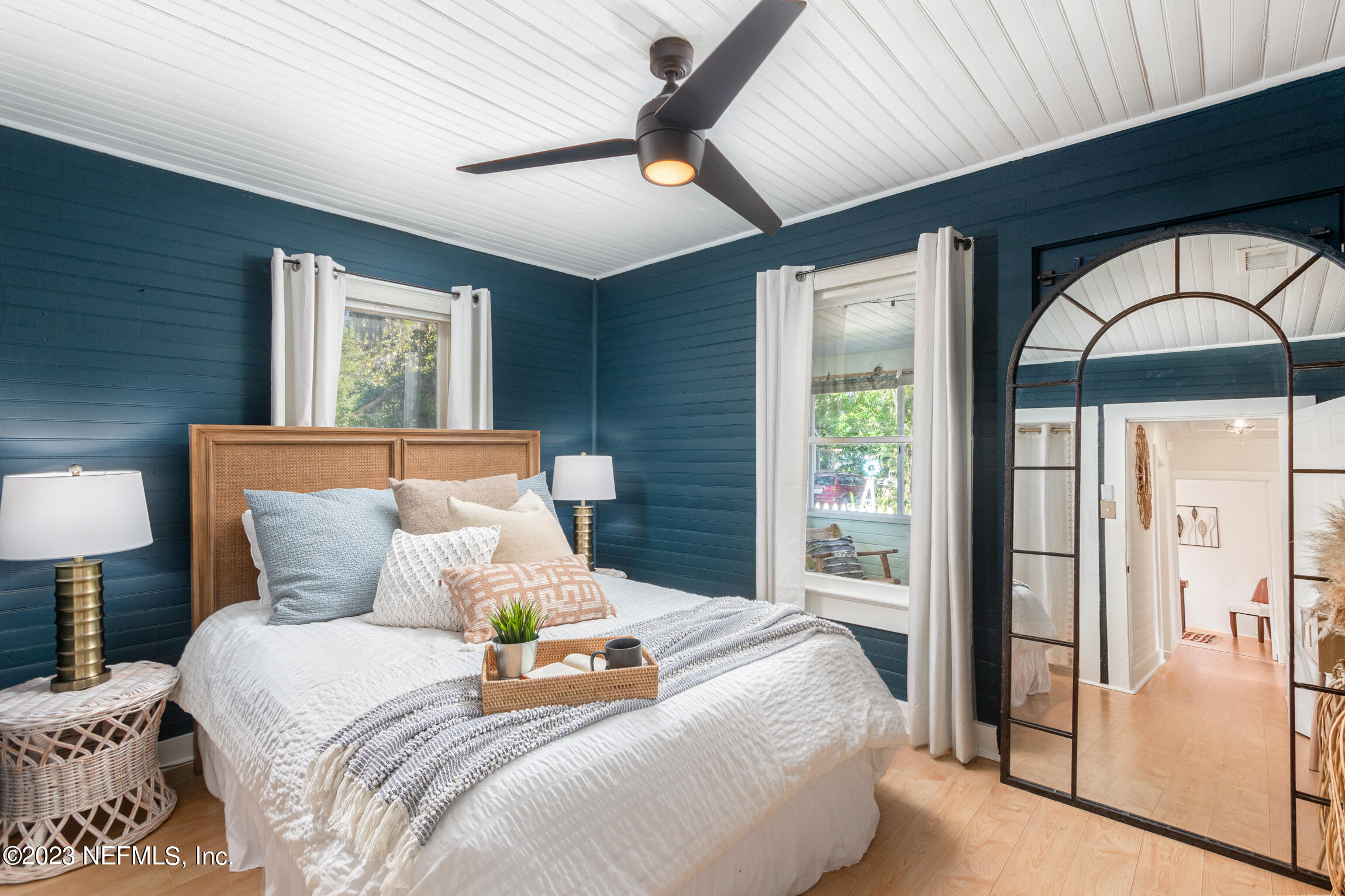 11 Newcomb Street St. Augustine, FL 32084 - Photo 14 of 35 a bedroom with a bed and a lamp