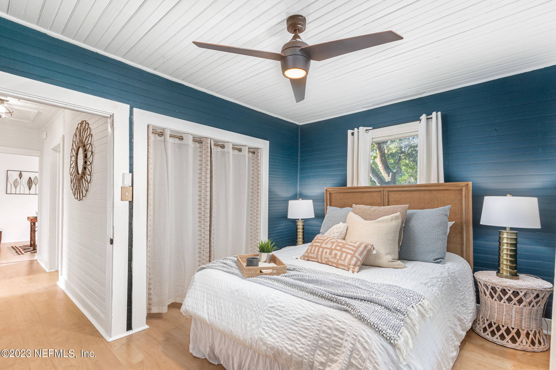 11 Newcomb Street St. Augustine, FL 32084 - Photo 15 of 35 a bedroom with a bed and a chandelier