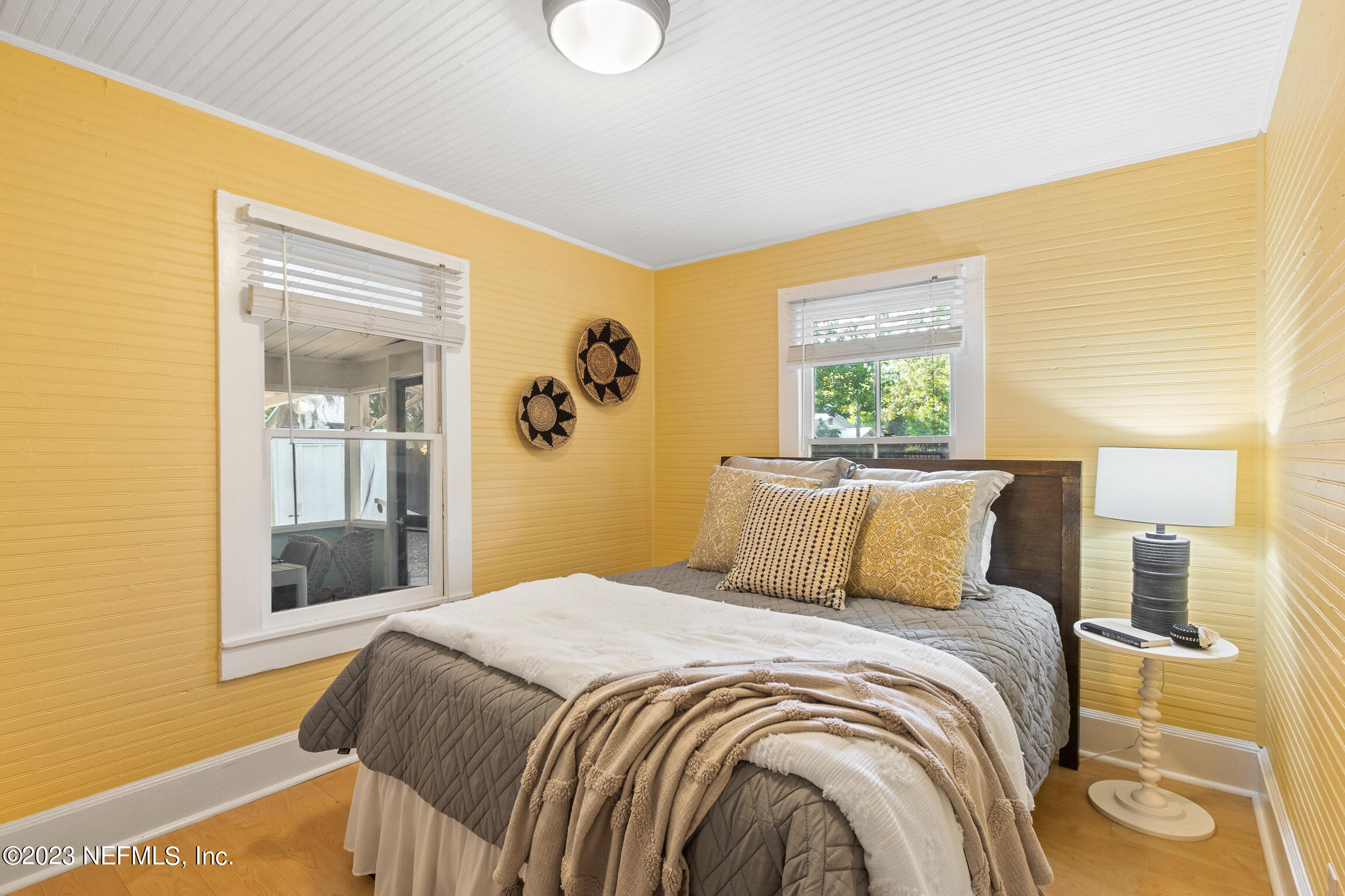 11 Newcomb Street St. Augustine, FL 32084 - Photo 16 of 35 a bedroom with a large bed and a window