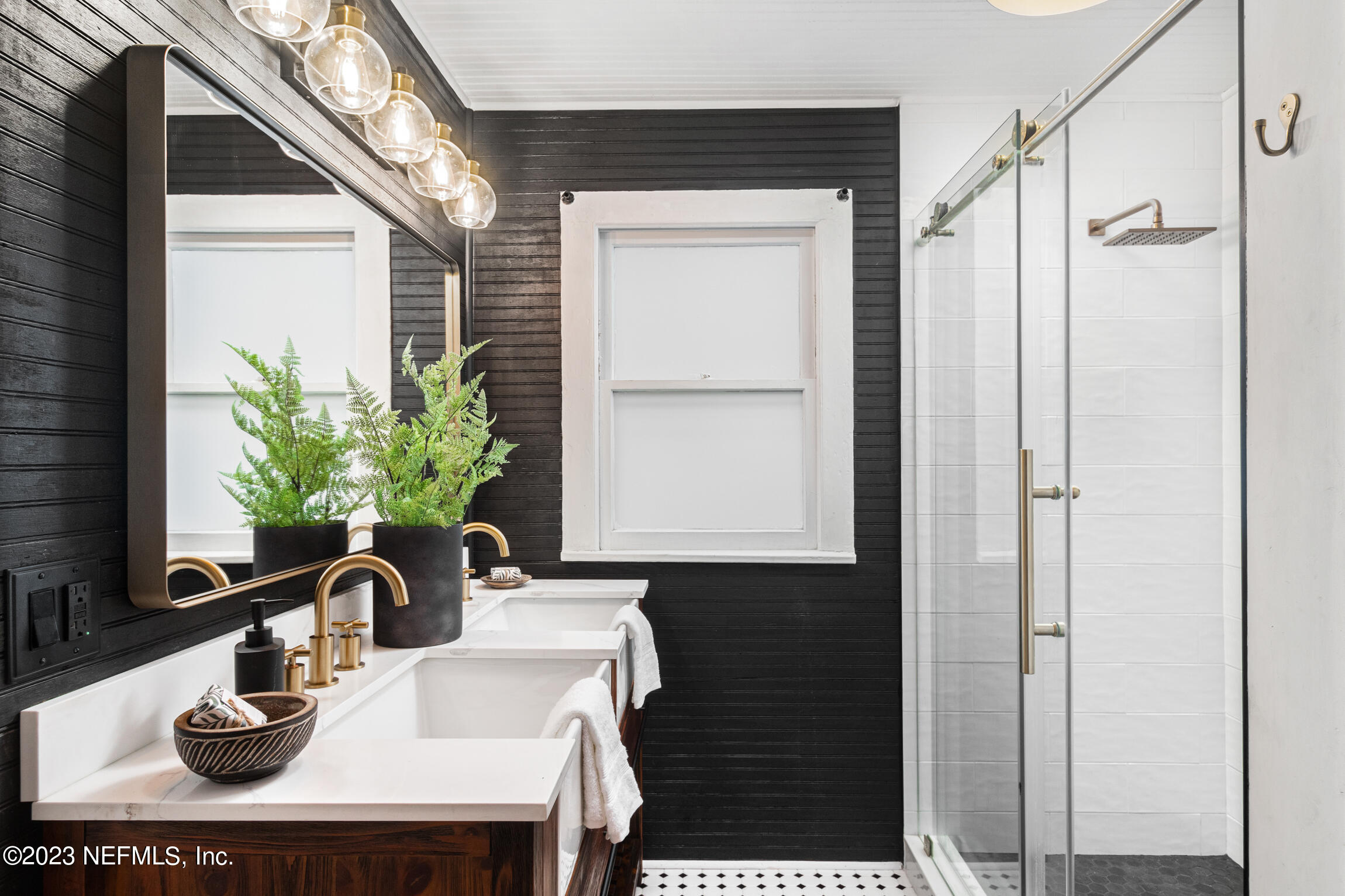 11 Newcomb Street St. Augustine, FL 32084 - Photo 19 of 35 a bathroom with a sink a vanity and a mirror