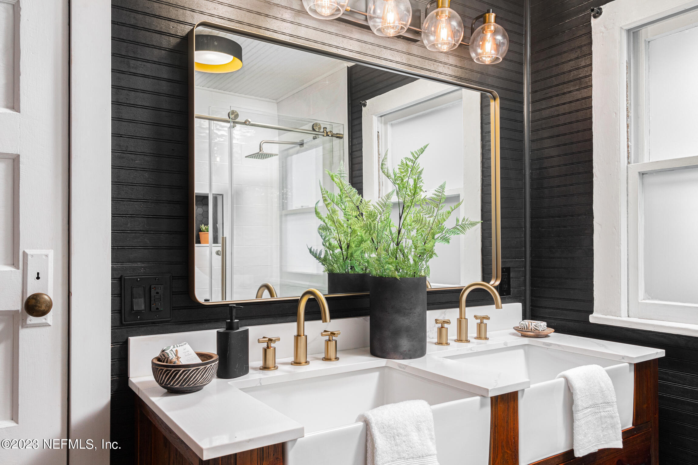 11 Newcomb Street St. Augustine, FL 32084 - Photo 20 of 35 a bathroom with a granite countertop sink and a mirror