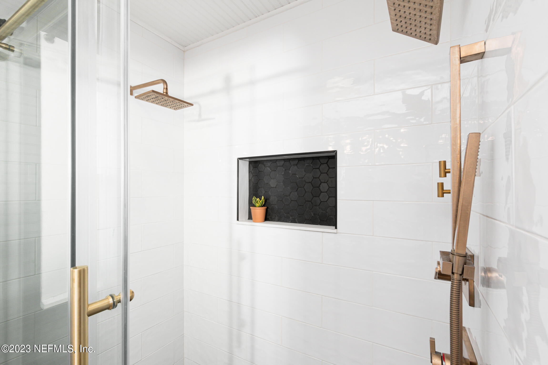 11 Newcomb Street St. Augustine, FL 32084 - Photo 21 of 35 a bathroom with a shower and a mirror