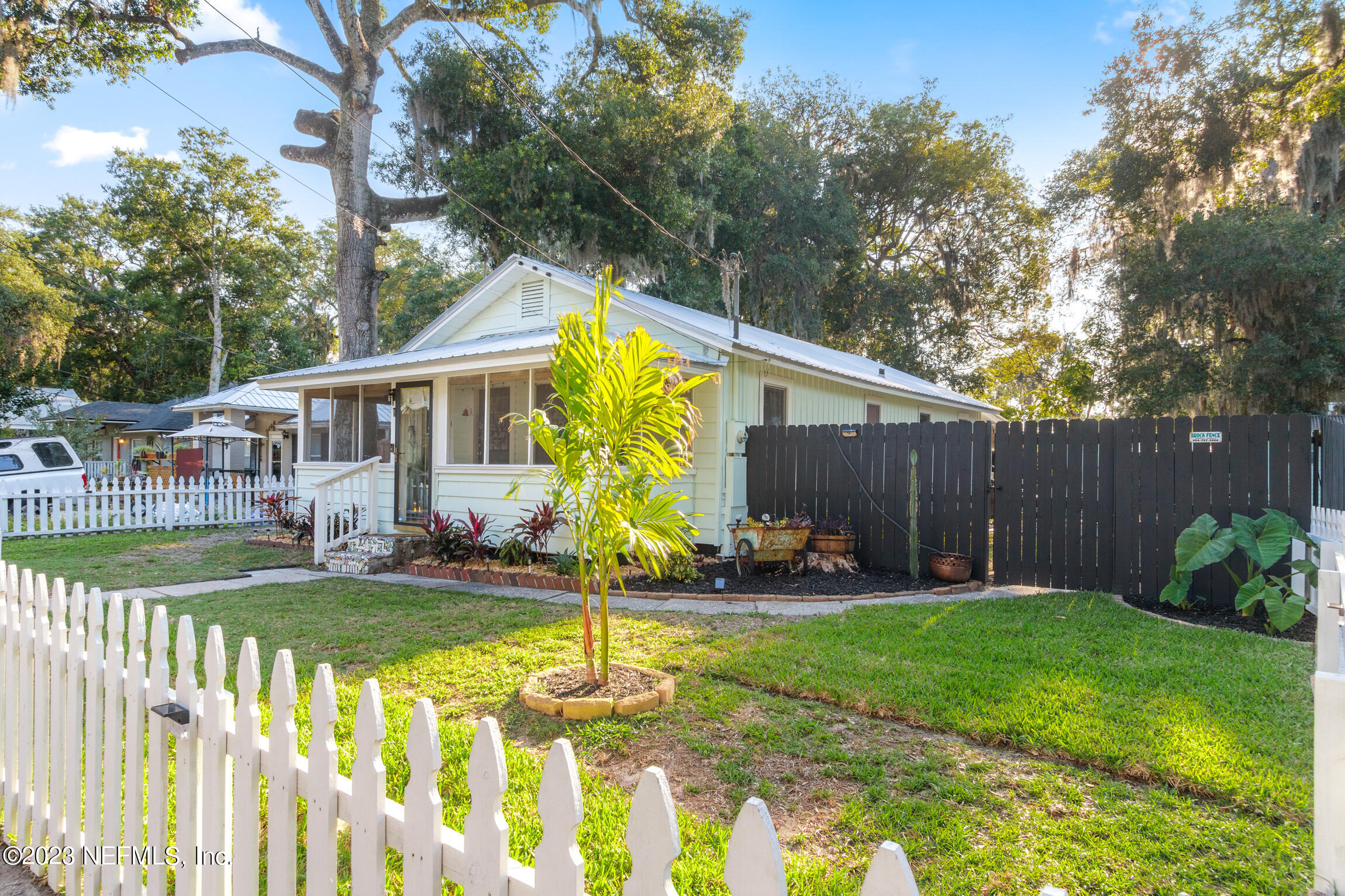 11 Newcomb Street St. Augustine, FL 32084 - Photo 31 of 35 a view of a house with backyard and sitting area