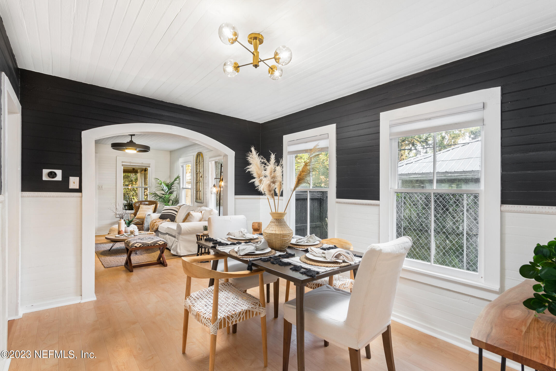 11 Newcomb Street St. Augustine, FL 32084 - Photo 8 of 35 a view of a dining room with furniture large windows and wooden floor